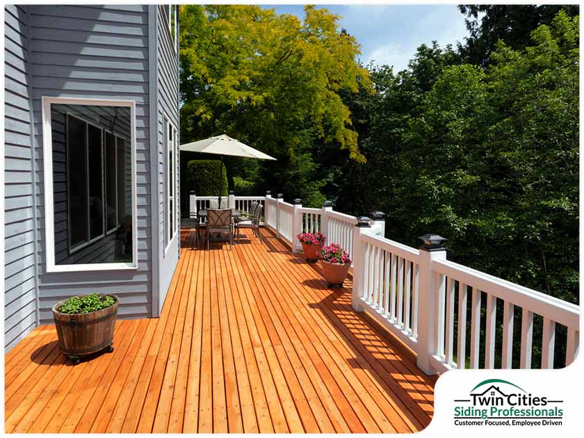 13 1624315598 Elevated Wraparound Wood Deck Blue Gray Siding Jpg