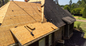 House With New Roof Being Installed